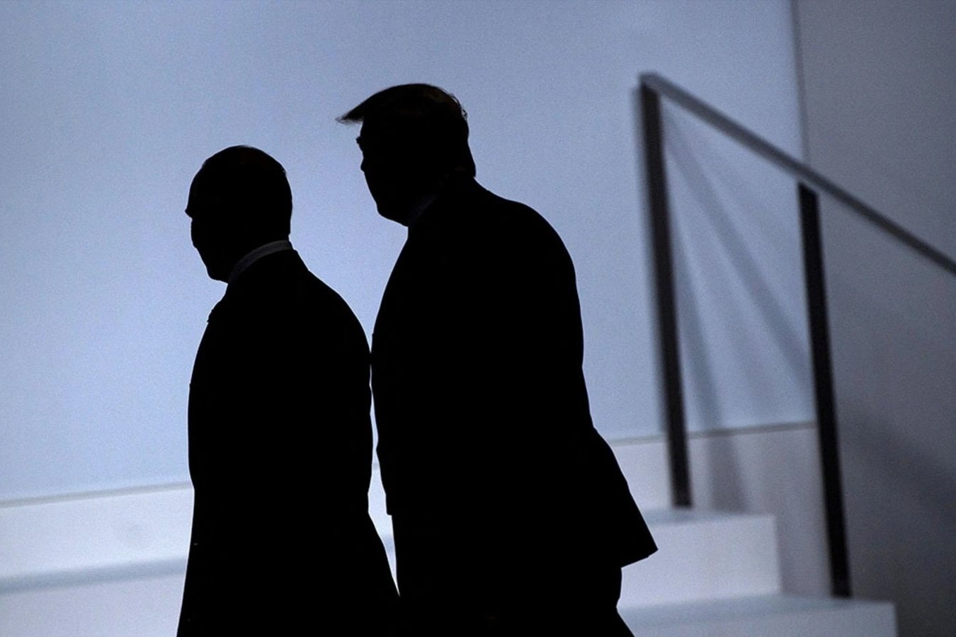 Russia's President Vladimir Putin (L) and US President Donald Trump arrive for a group photo at the G20 Summit in Osaka on June 28, 2019.
