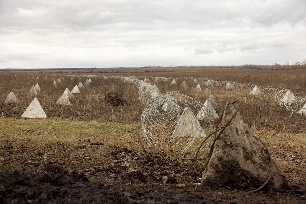 Fortifications built by the Ukrainian army stretch across a field near the front line outside Kupiansk, Ukraine. (Thomas Peter/Reuters)