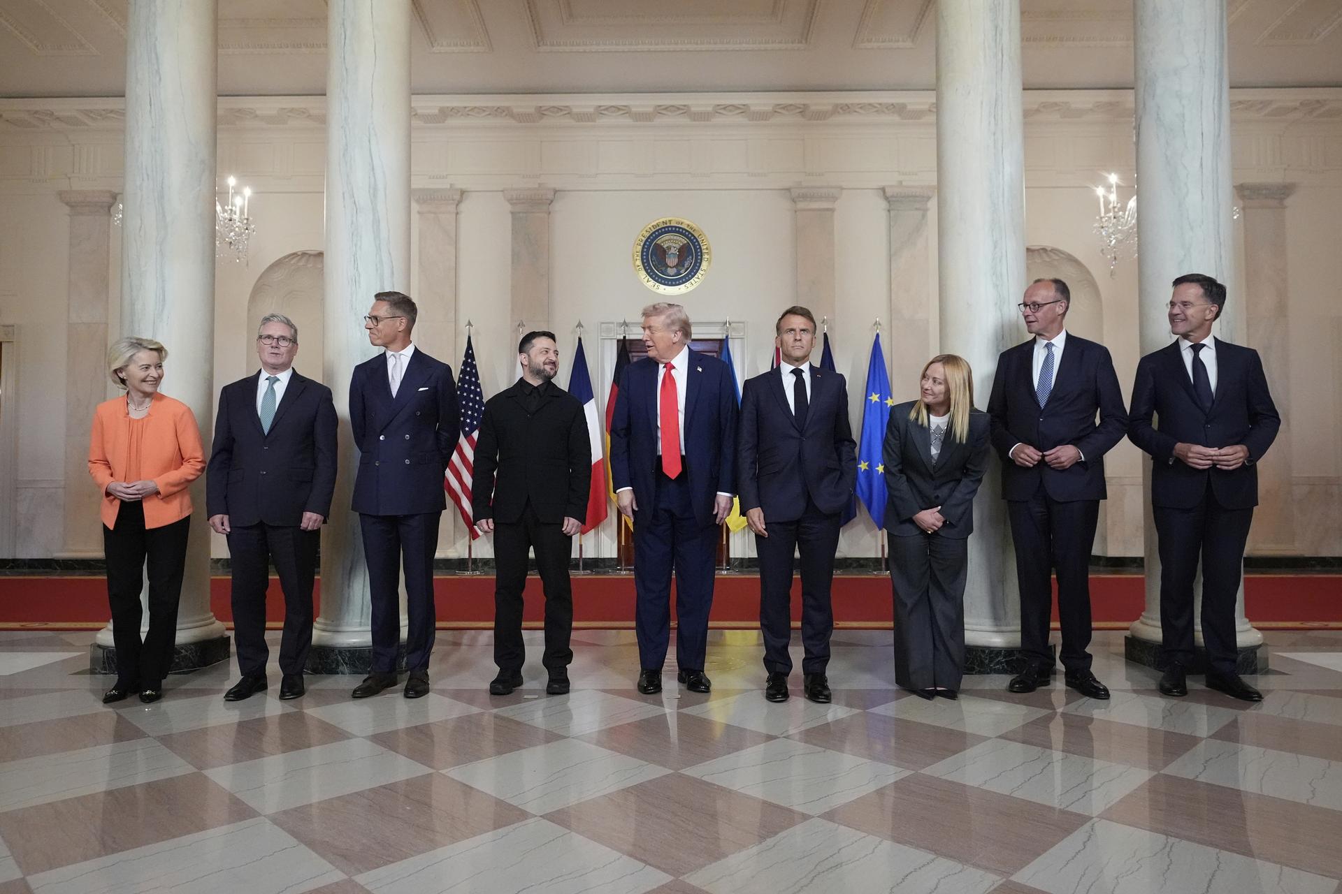 European Commission President Ursula von der Leyen, British Prime Minister Keir Starmer, Finland's President Alexander Stubb, Ukrainian President Volodymyr Zelenskyy, US President Donald Trump, France's President Emmanuel Macron, Italy's Prime Minister Giorgia Meloni, Germany's Chancellor Friedrich Merz and NATO Secretary General Mark Rutte pose for a group photo in the Grand Foyer of the White House, Monday. 