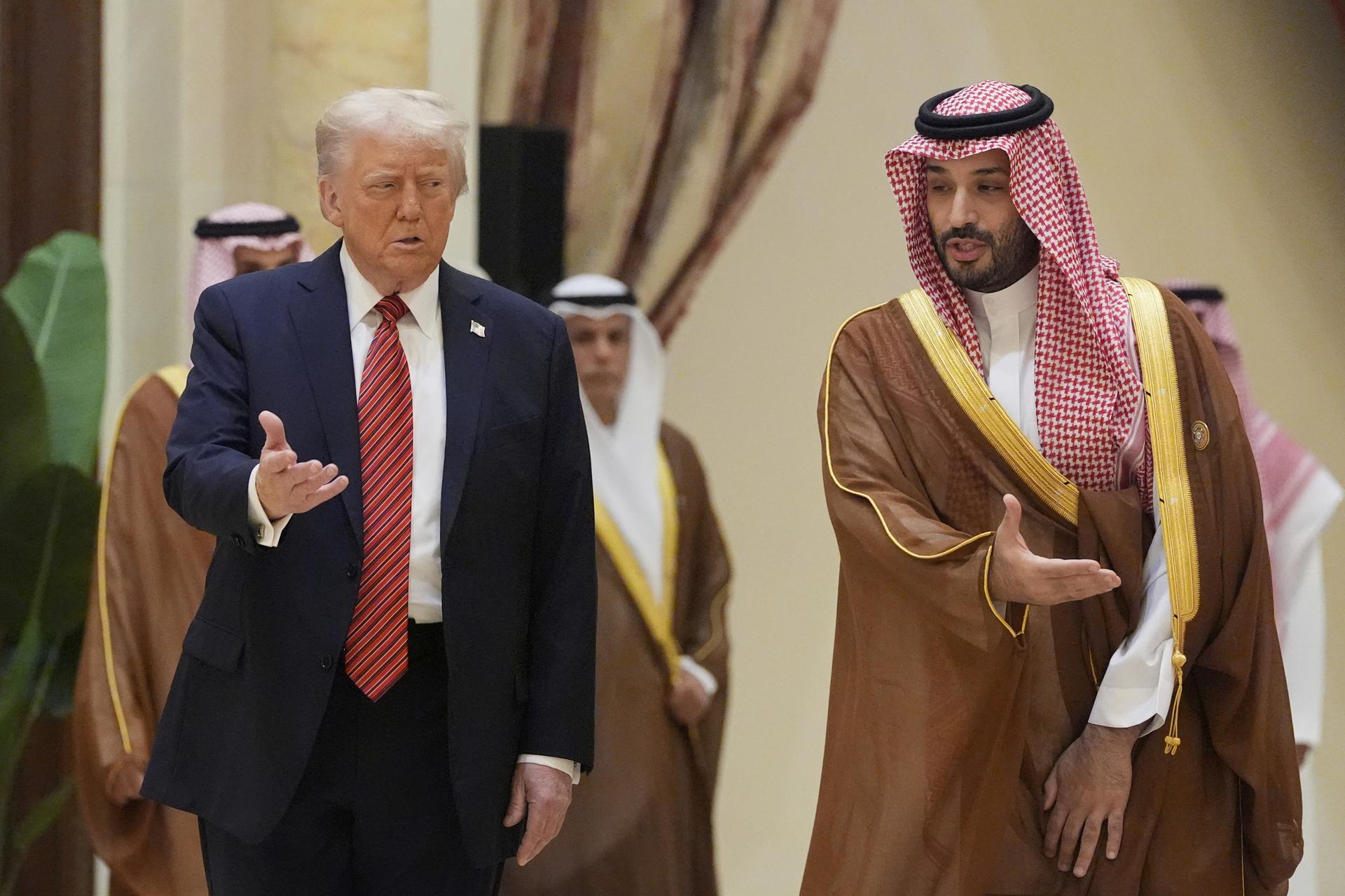President Donald Trump walks with Saudi Crown Prince Mohammed bin Salman.