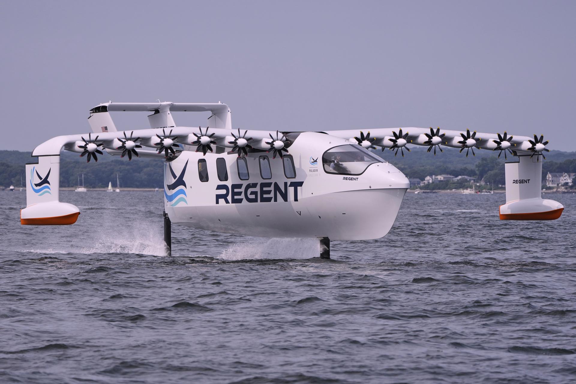 The REGENT Viceroy Seaglider, a winged passenger ferry, glides over the surface of Narragansett Bay on a test run Aug. 6. (AP Photo/Charles Krupa