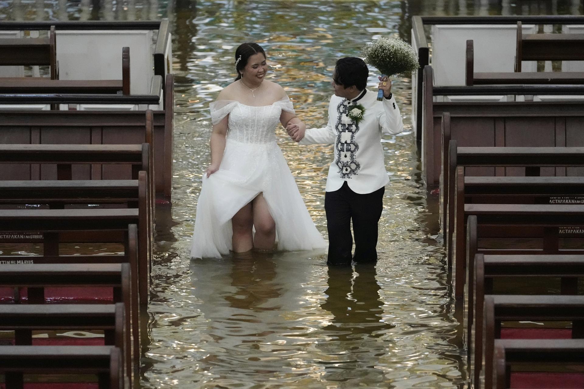 Newlyweds Jade Rick Verdillo and Jamaica Aguilar during their wedding in Malolos, Bulacan province, Philippines on Tuesday.
