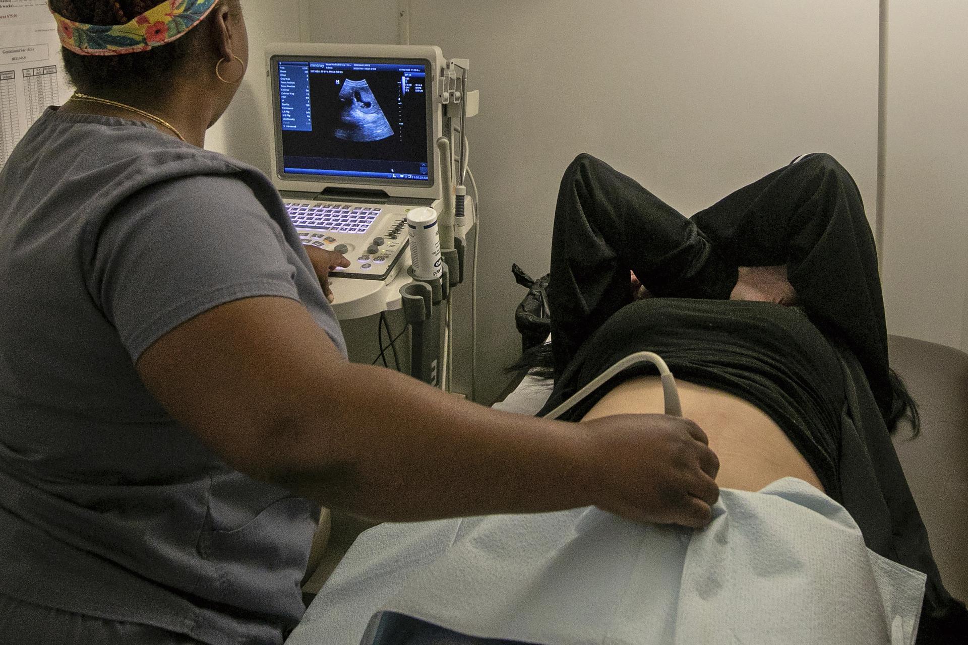 An operating room technician performs an ultrasound at an abortion clinic in Shreveport, La., in 2022. 