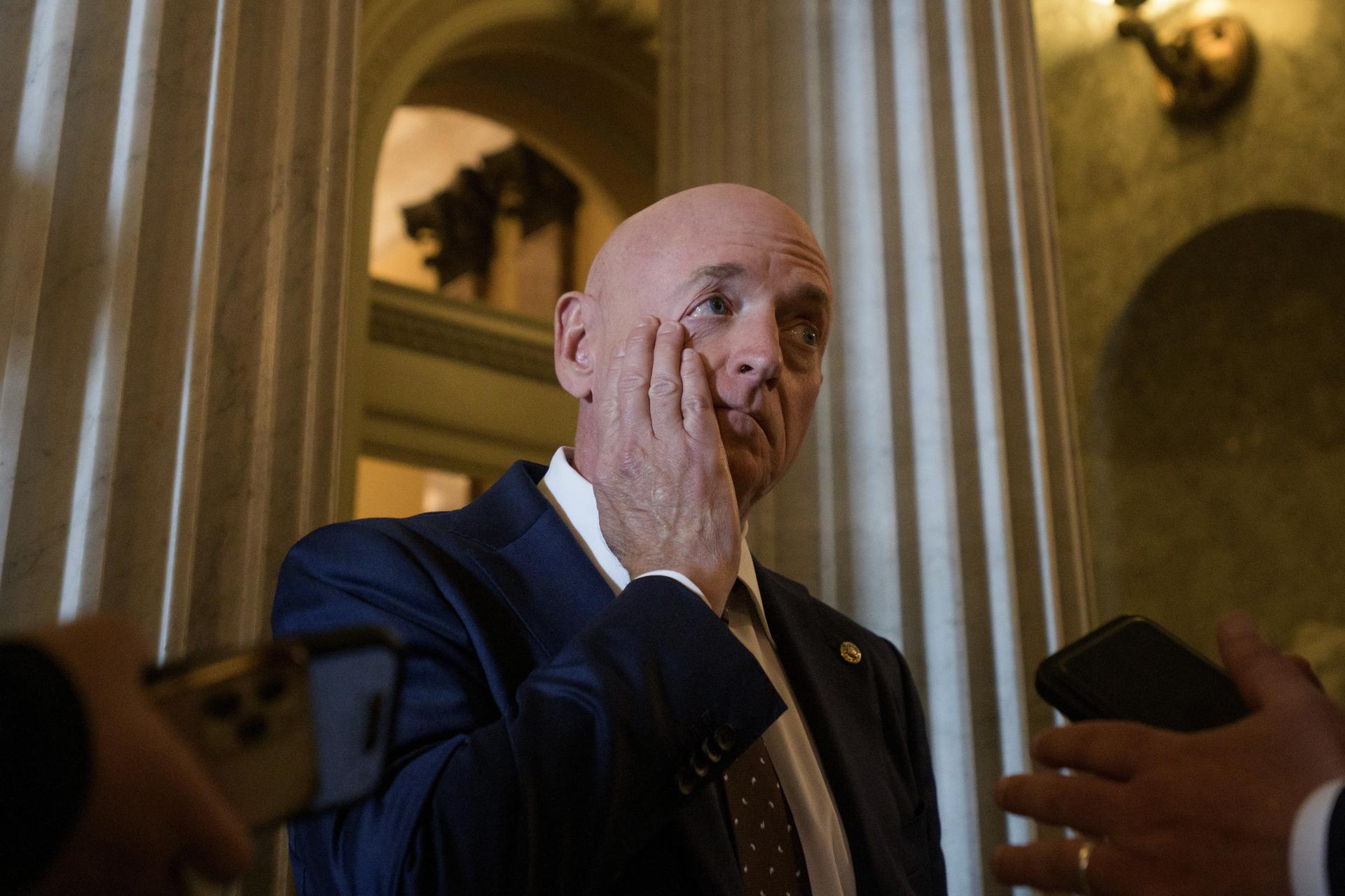 Sen. Mark Kelly, D-Ariz., talks with reporters outside the Senate chamber at the Capitol in Washington on Wednesday.