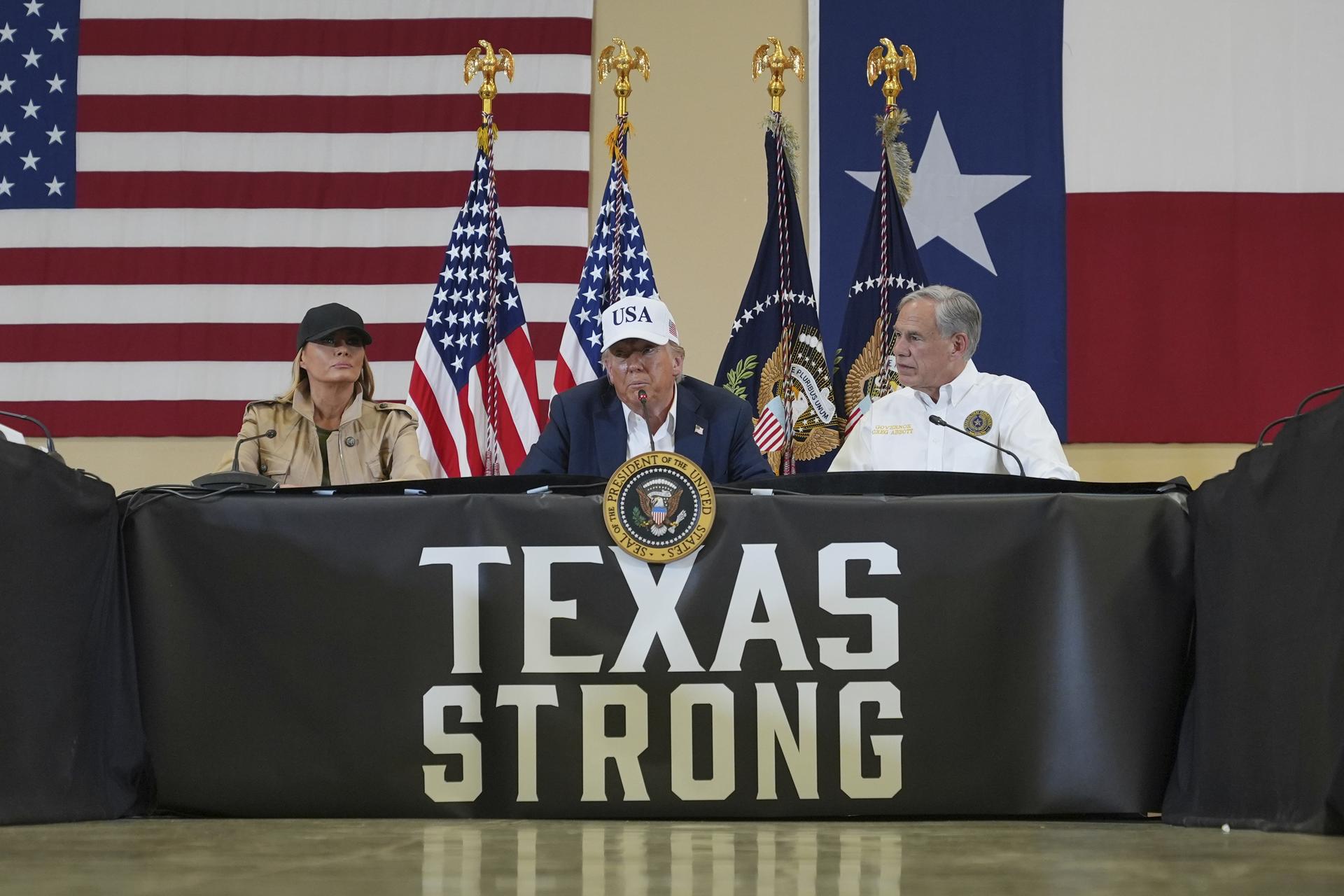 President Donald Trump, first lady Melania Trump, and Texas Gov. Greg Abbott at Hill Country Youth Event Center in Kerrville, Texas, during a tour to observe flood damage, July 11.