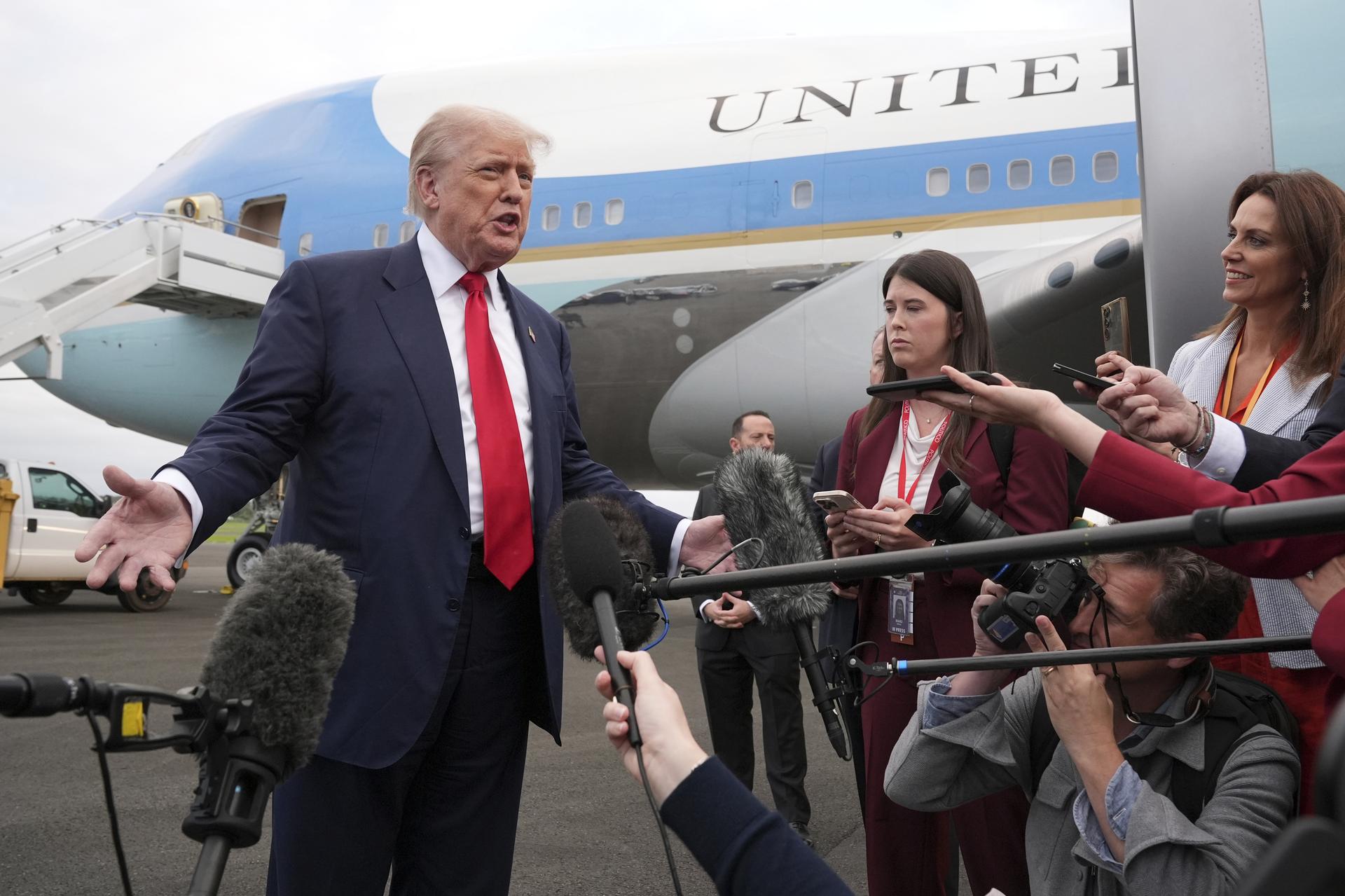 President Donald Trump speaks to members of the media after he arrived at Prestwick Airport in Ayrshire, Scotland, on Friday. (AP Photo/Jacquelyn Martin)
