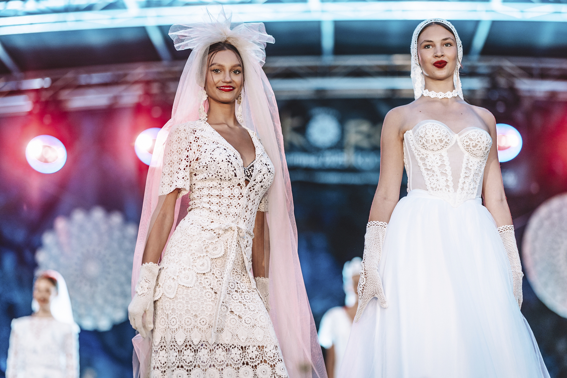 Models present hand-made lace outfits during a fashion show in the village of Koniakow on Saturday. (AP Photo/Daniel Franek)