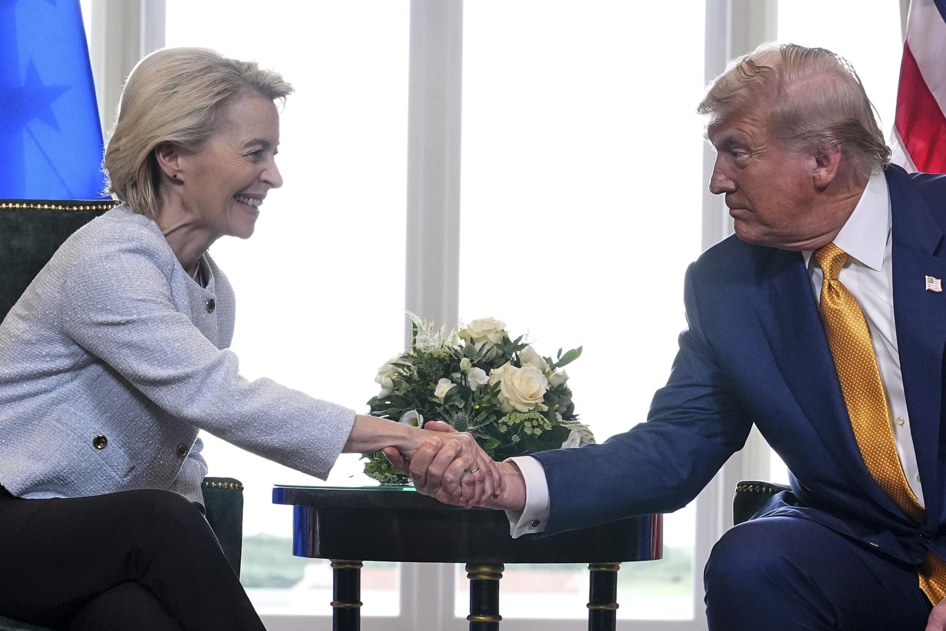 President Donald Trump and European Commission President Ursula von der Leyen shake hands after reaching a trade deal at the Trump Turnberry golf course in Scotland on Sunday.