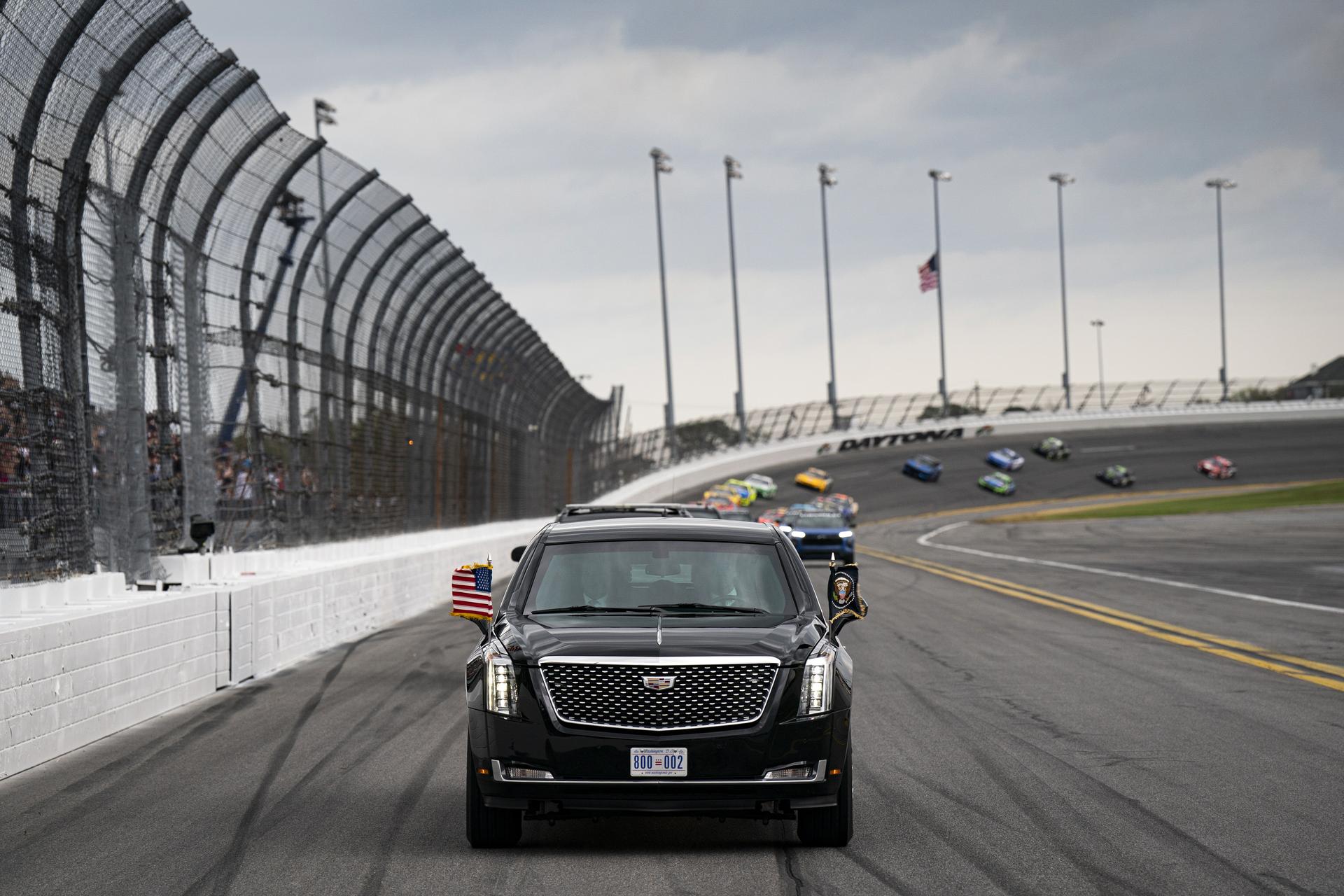 President Donald Trump rides in the presidential limousine known as ''The Beast'' as he takes a pace lap ahead of the start of the NASCAR Daytona 500.