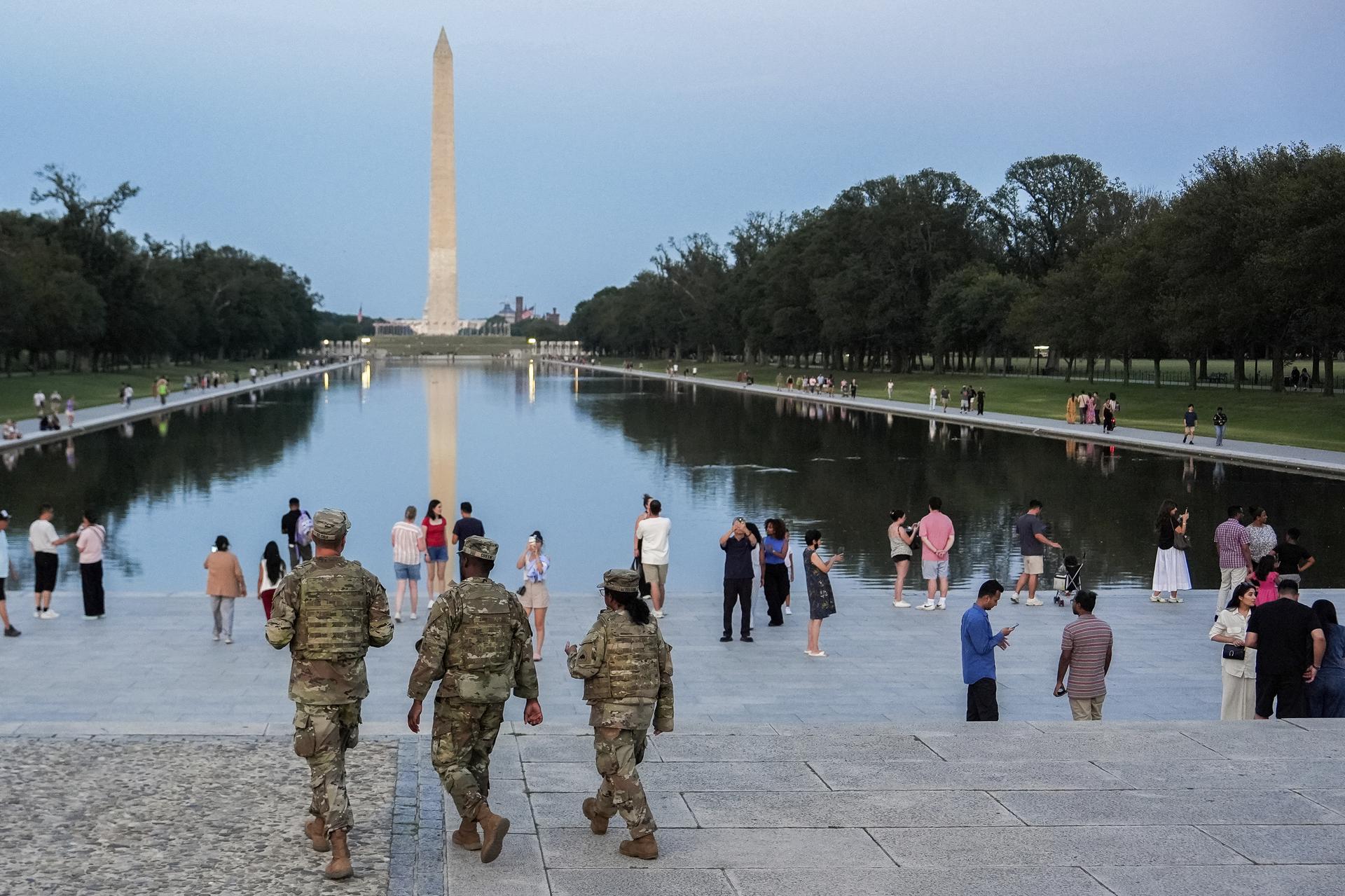 Members of the District of Columbia National Guard patrol along the National Mall Saturday in Washington. (AP Photo/Julia Demaree Nikhinson)