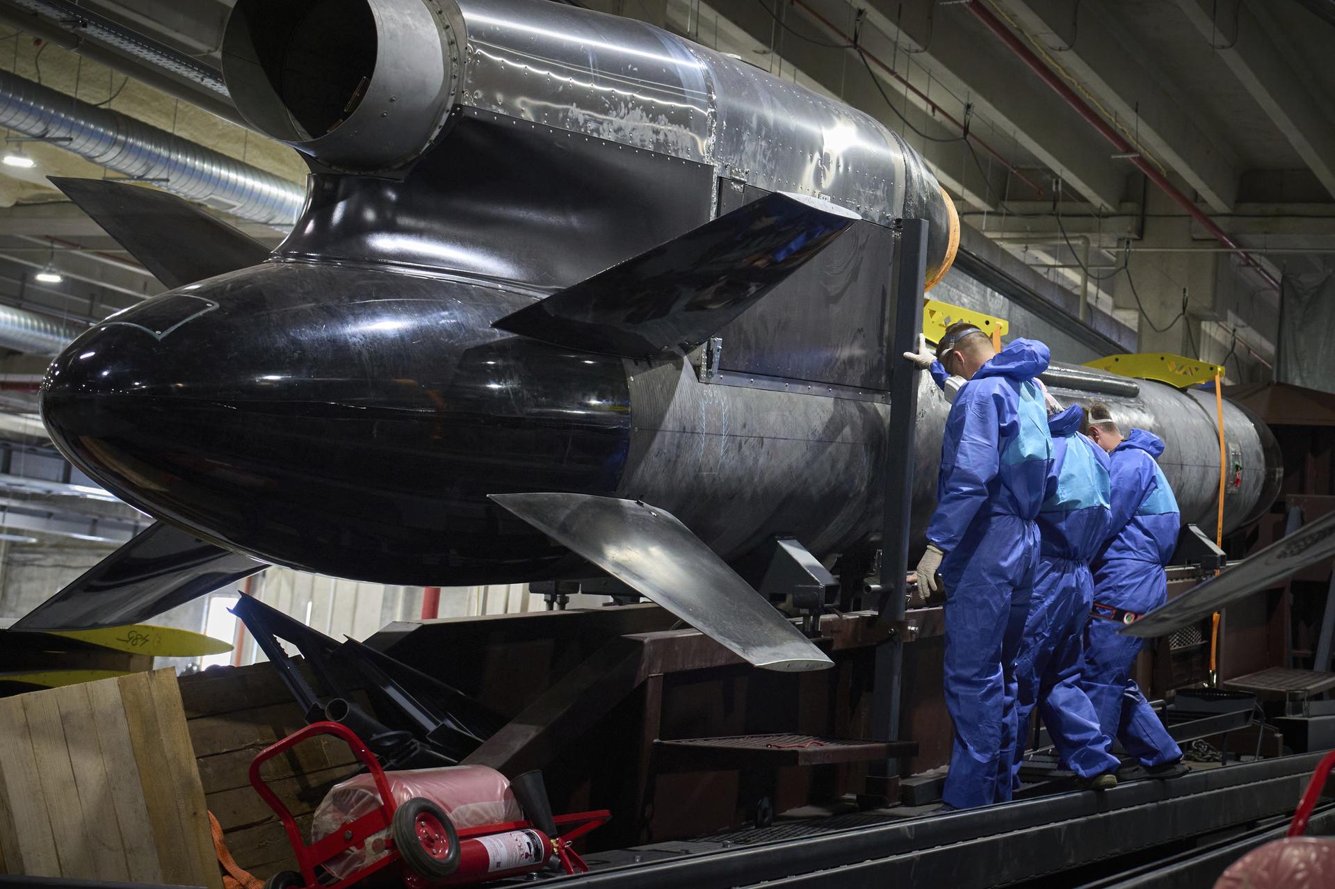Workers inspect a Flamingo cruise missile at Fire Point's secret factory in Ukraine on Monday. (AP Photo/Efrem Lukatsky)
