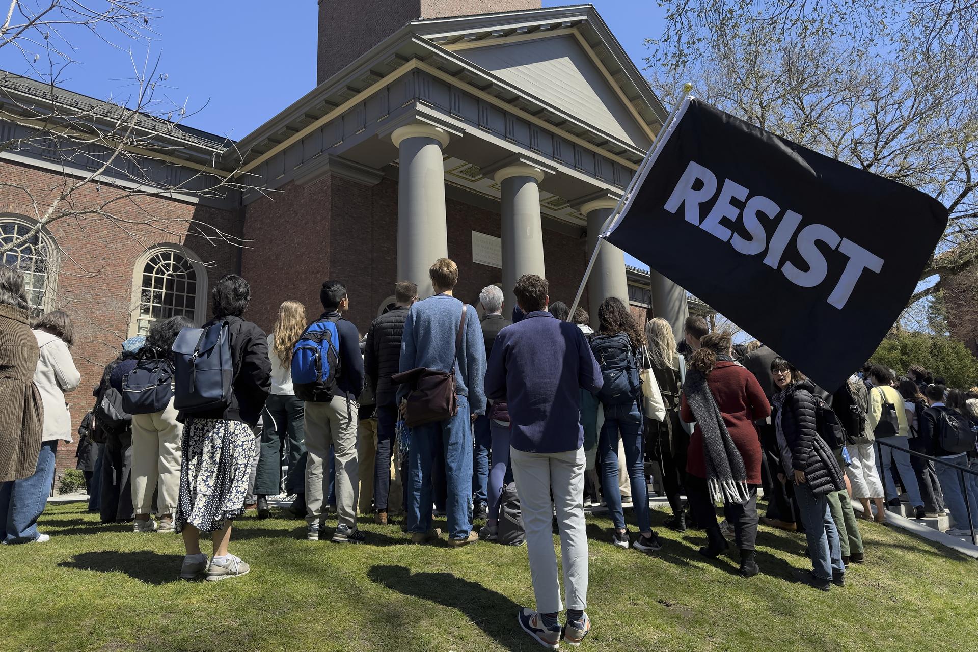 Students, faculty, and members of the Harvard University community rally in April in Cambridge, Mass.