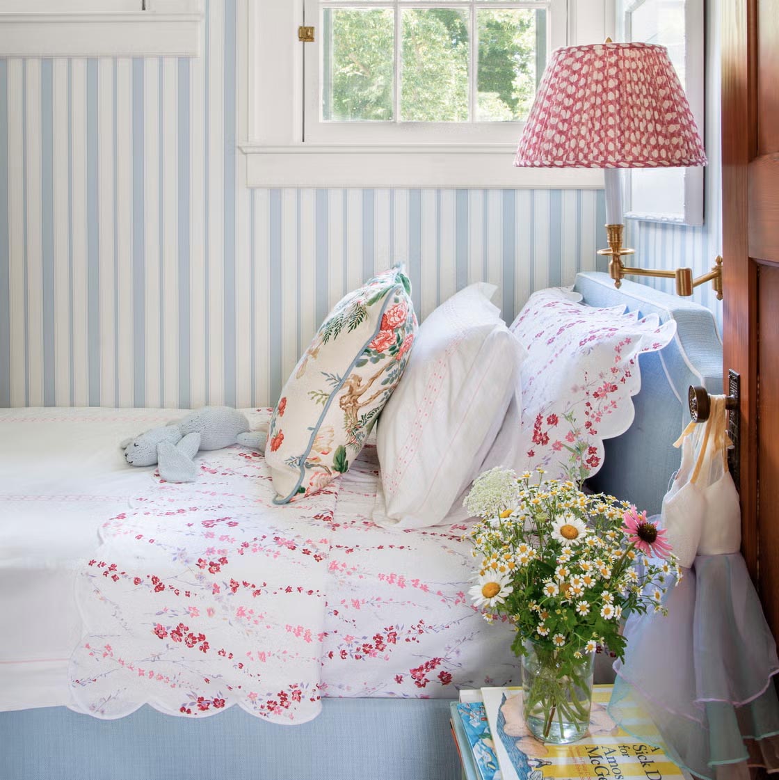 charming blue and white bedroom with striped wallpaper