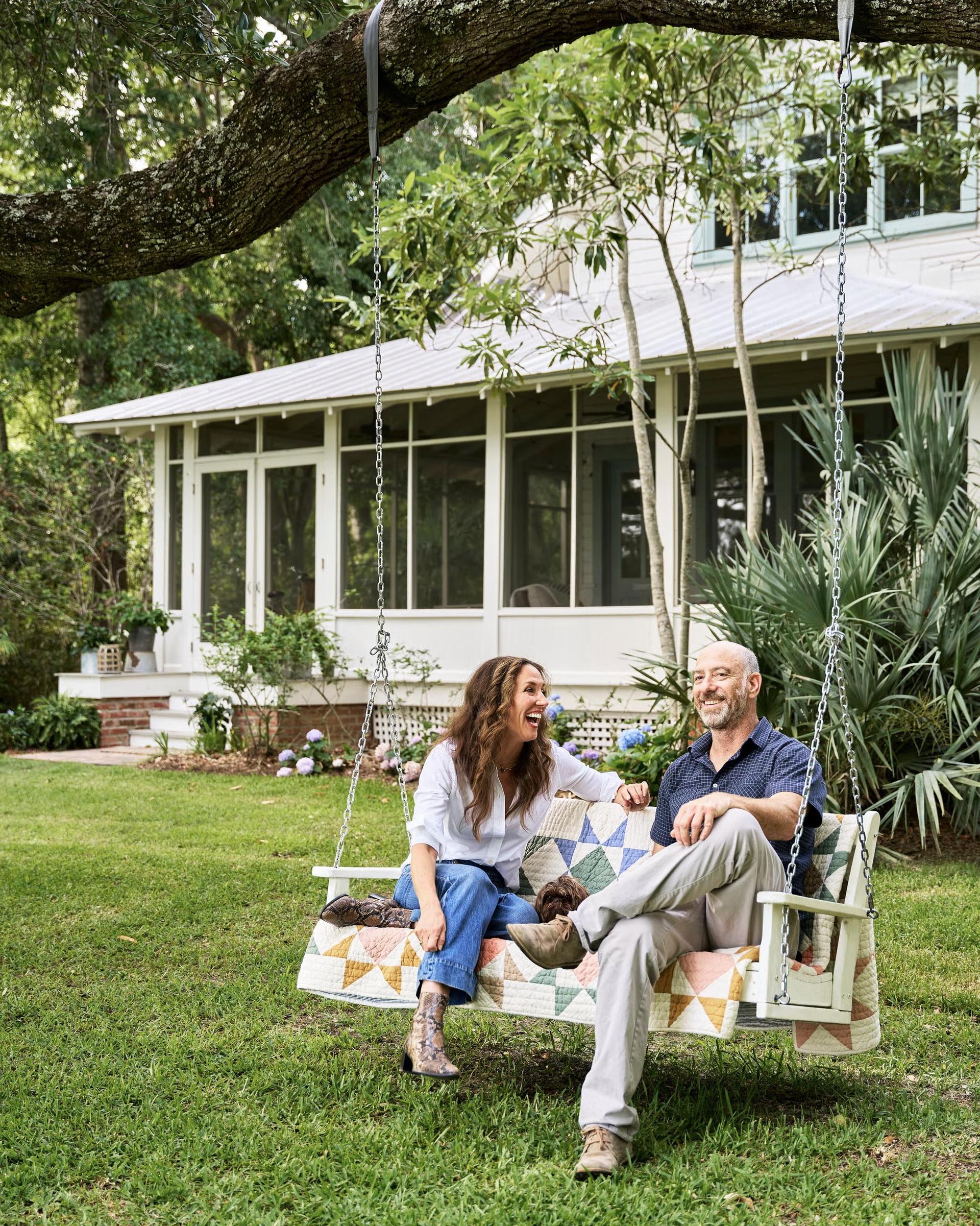 charming house with screened in front porch and tree swing