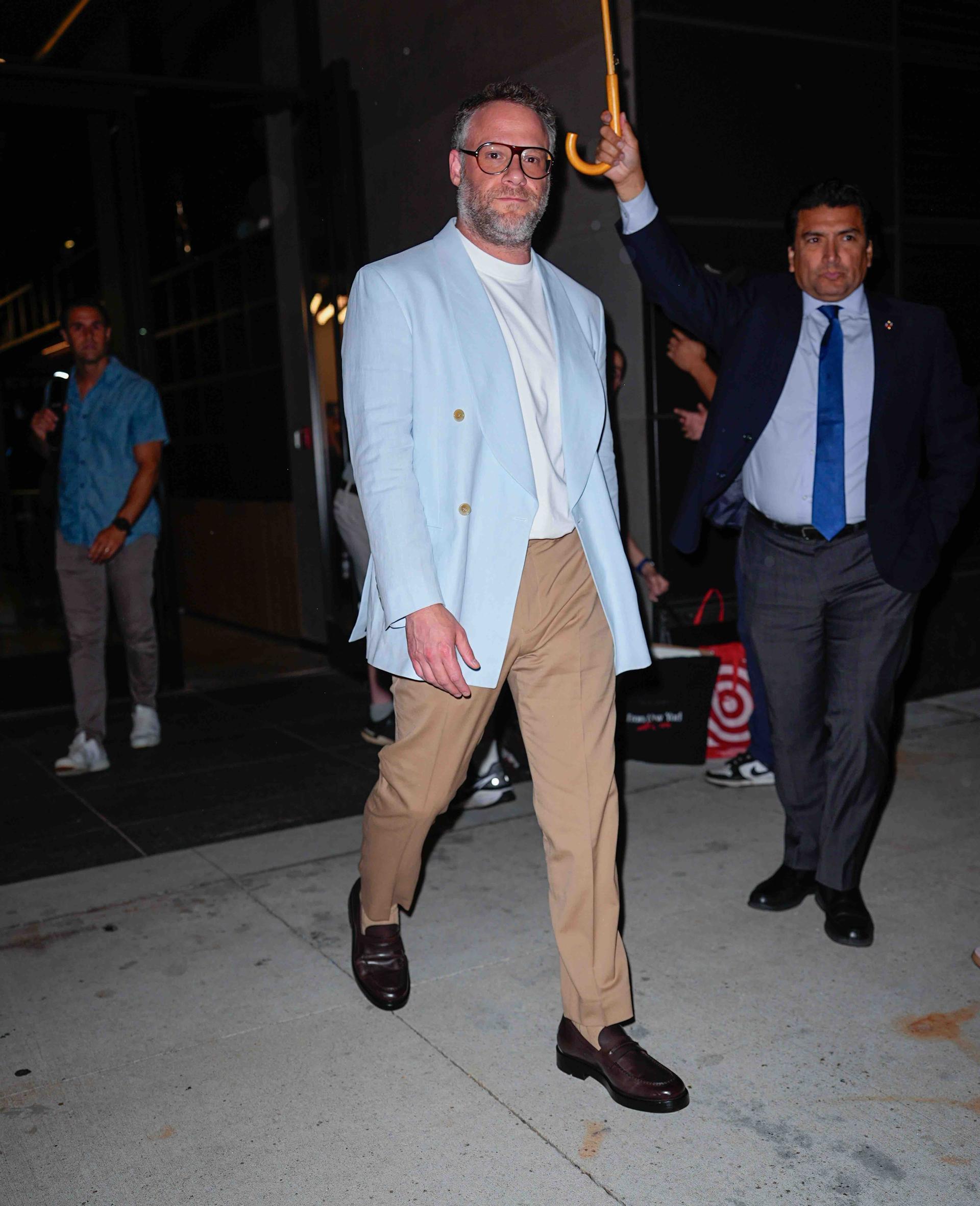Image may contain: Seth Rogen, Clothing, Coat, Jacket, Blazer, Formal Wear, Suit, Adult, Person, People, Accessories, and Tie