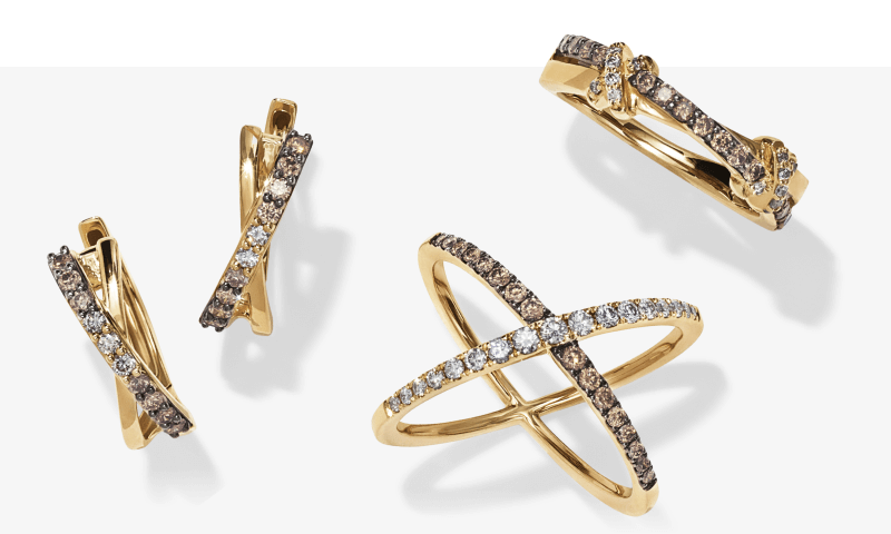 Two examples of rings and a pair of earrings from Le Vian