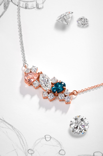 Image showcasing Diamonds on a artisans table, alongside a stunning personalized Diamond Necklace.