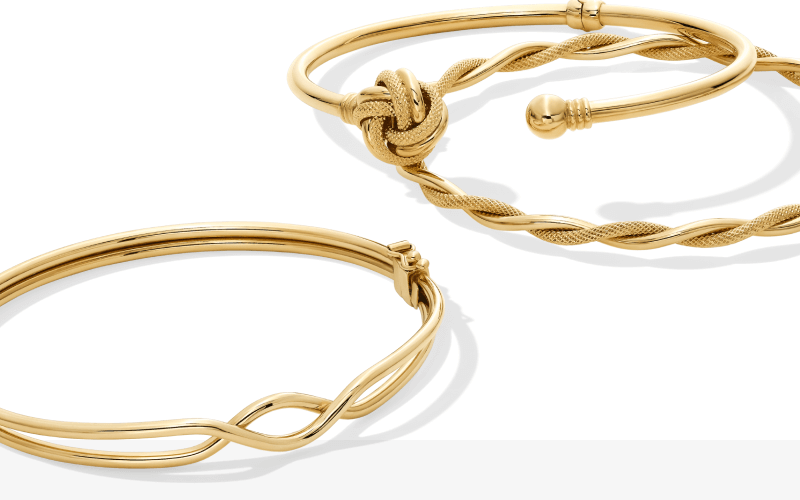 Three examples of Reaura gold bracelets