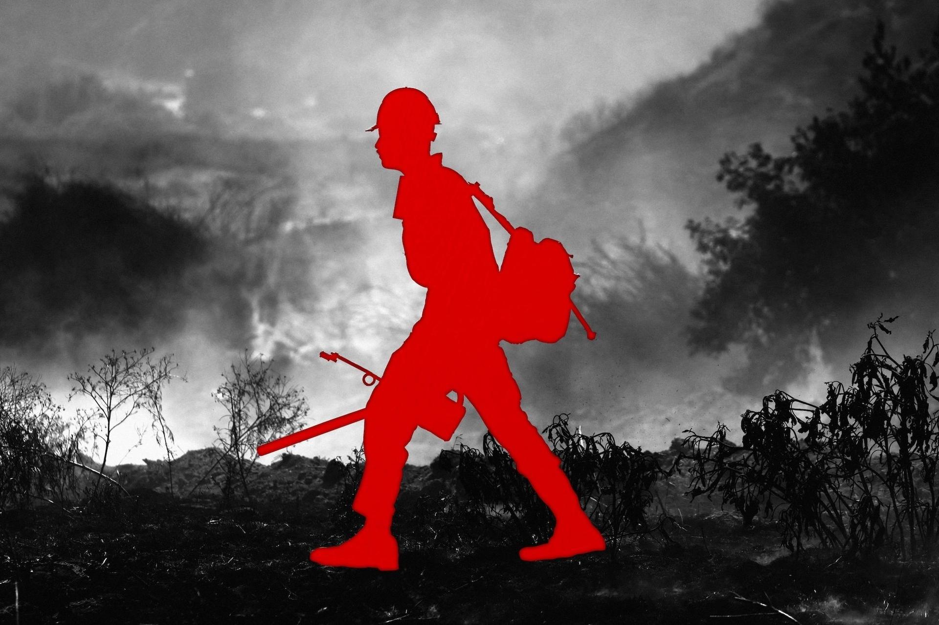 Photo illustration of a red silhouette of a firefighter over a burnt landscape