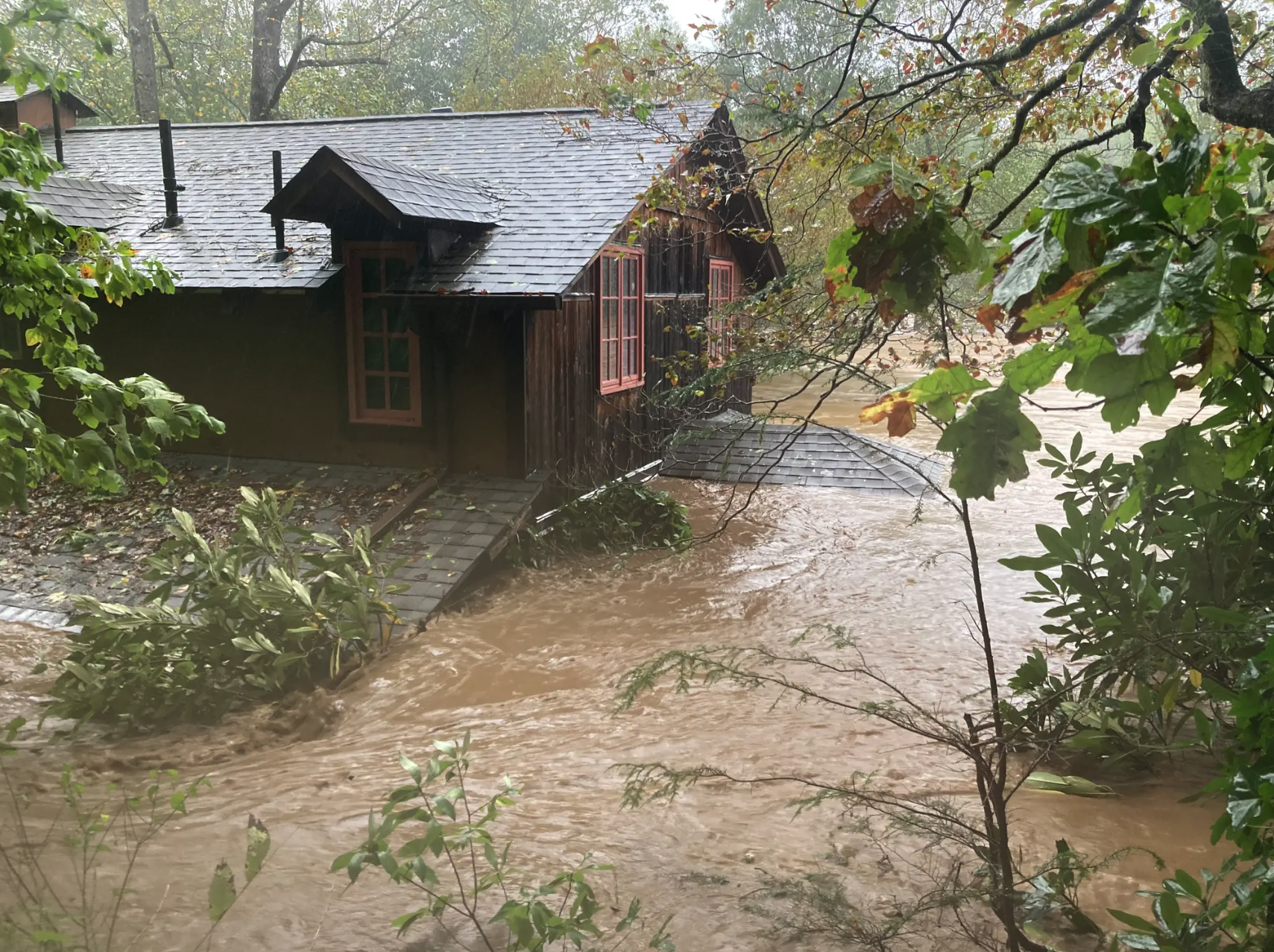 A home in Yancey County, North Carolina as floodwaters rise during Hurricane Helene.