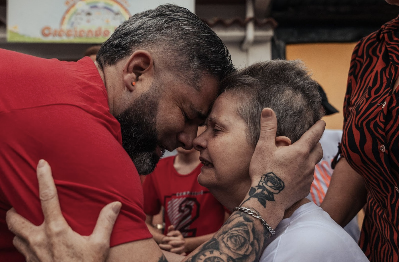 Wilmer Vega Sandia kisses his mother, Mireya, after seeing her in person for the first time since he was released from detention.