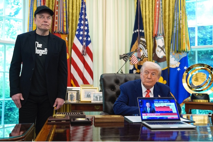 Elon Musk attends a news conference with President Donald Trump in the Oval Office on Friday. Evan Vucci/AP