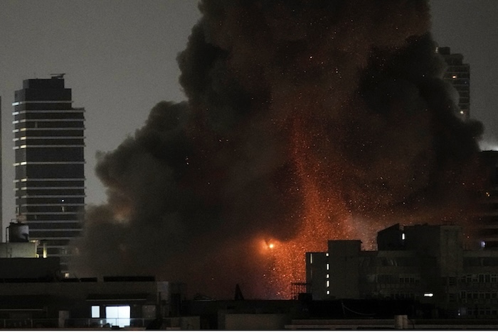 An explosion during a missile attack in Tel Aviv on Sunday. Leo Correa/AP 