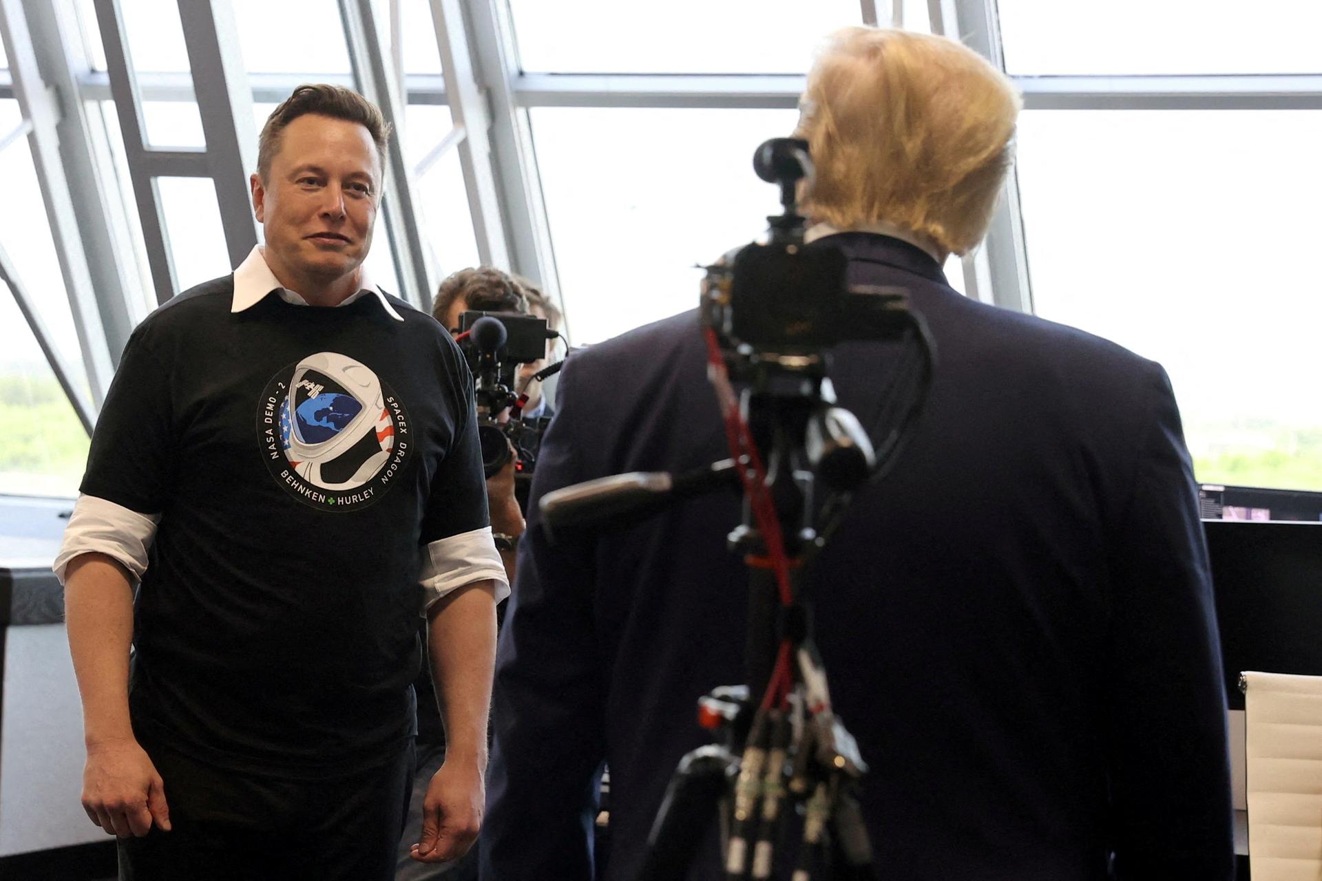 Donald Trump and Elon Musk are seen at the Firing Room Four after the launch of a SpaceX Falcon 9 rocket and Crew Dragon spacecraft