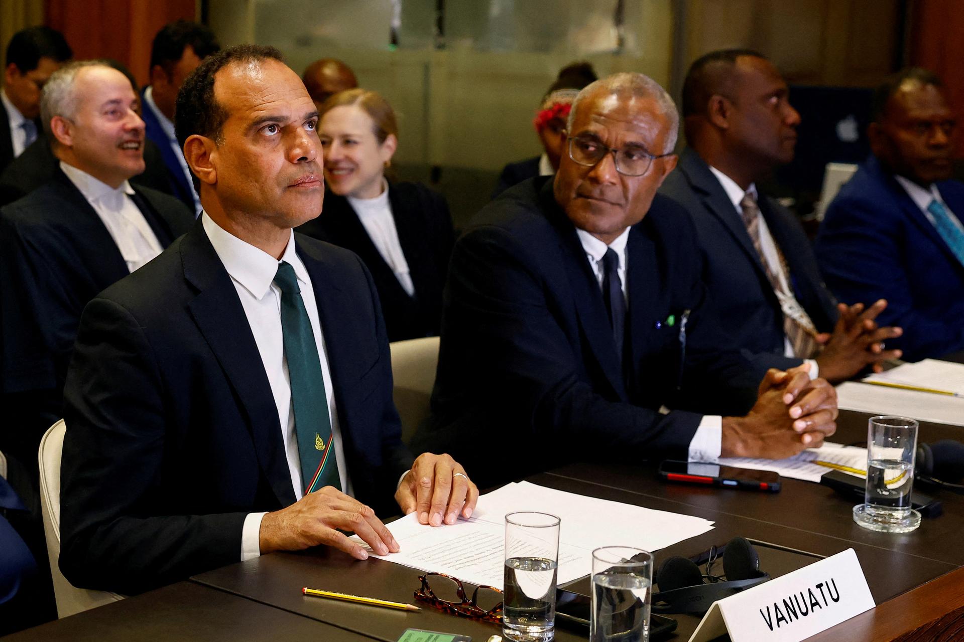 Ralph Regenvanu, Special Envoy for Climate Change and Environment for the Republic of Vanuatu, and Arnold Kiel Loughman, Attorney-General for the Republic of Vanuatu, attend ICJ public hearings. 