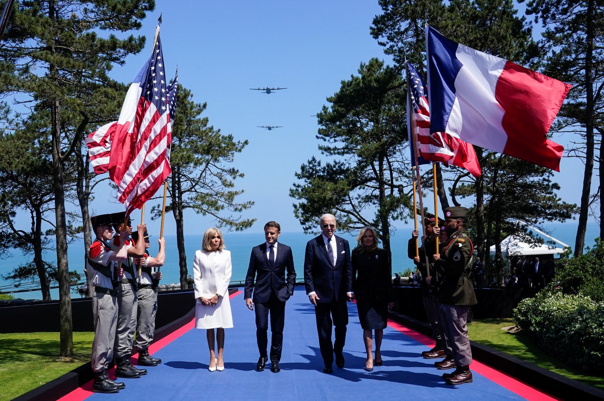 U.S President Joe Biden, first lady Jill Biden, French President Emmanuel Macron and his wife Brigitte Macron attend a ceremony to mark the 80th anniversary of D-Day at the Normandy American Cemetery and Memorial in Colleville-sur-Mer, France, June 6, 2024. REUTERS/Elizabeth Frantz