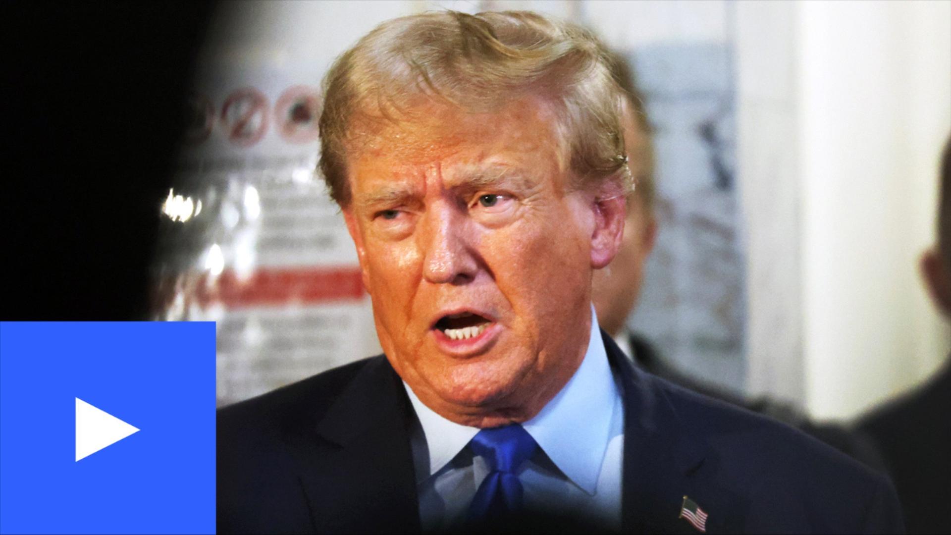 A photo of Trump talking to press