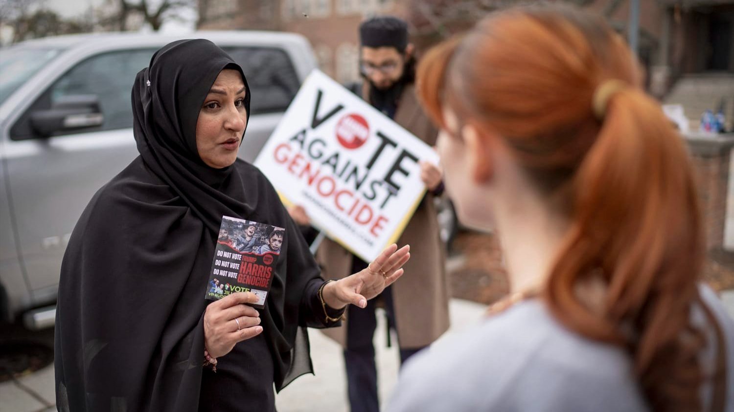 A photo of a woman holding a poster