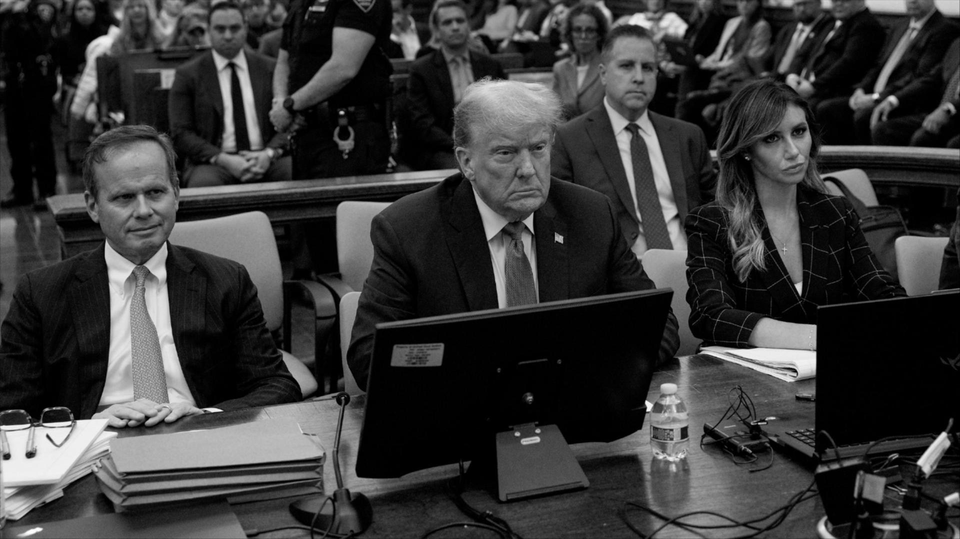 A black and white photo of Trump in court