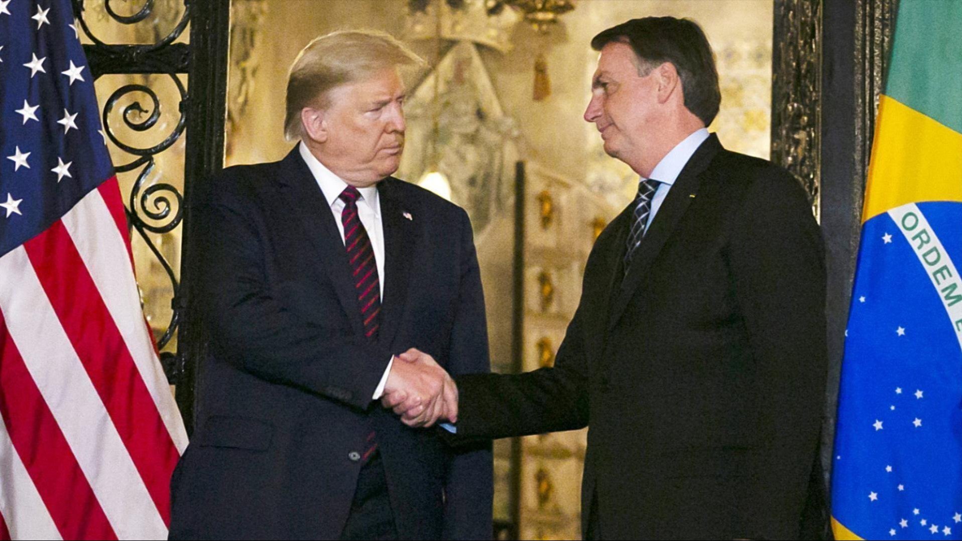 Photo of Trump and Bolsanaro shaking hands