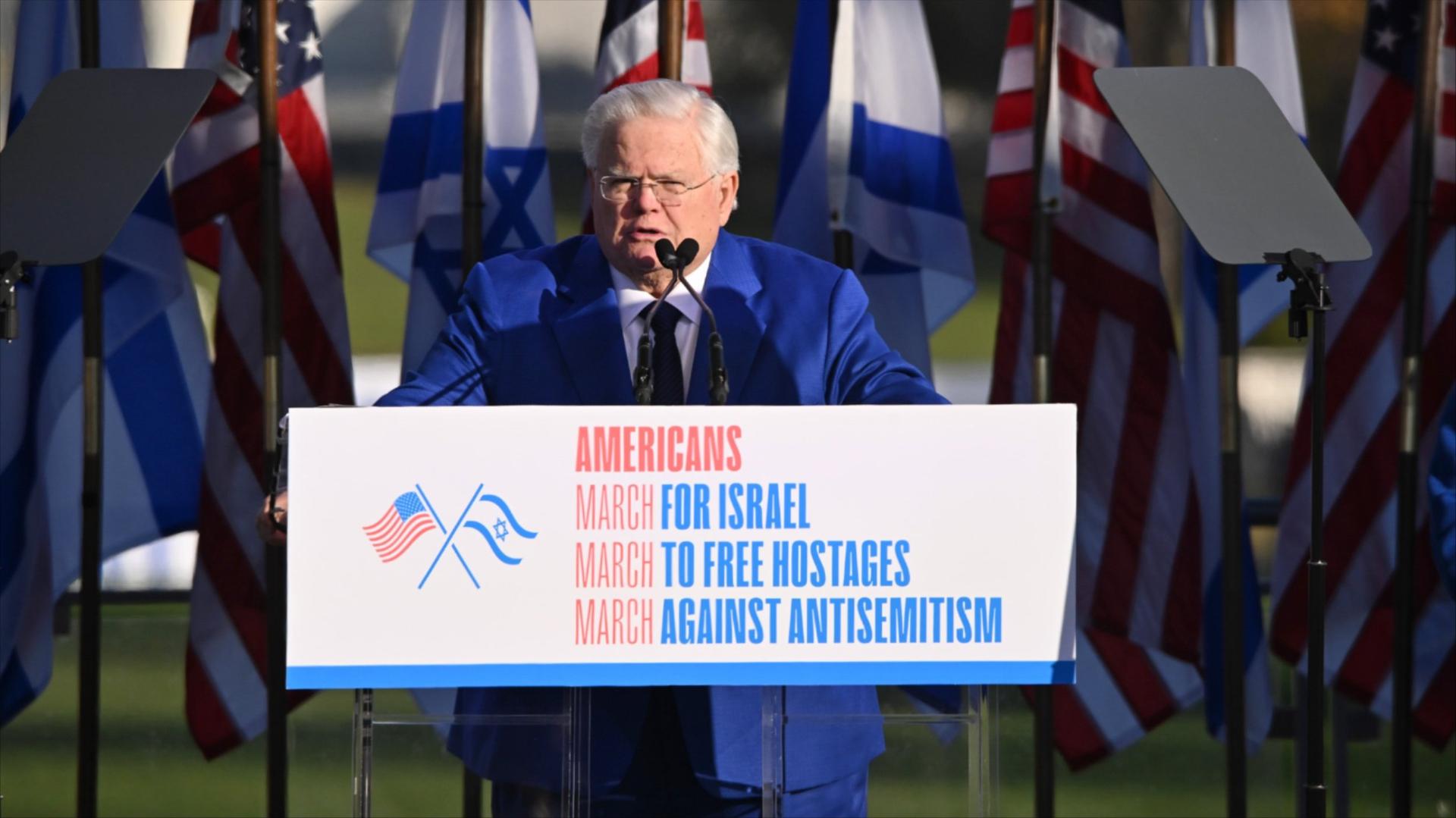 A photo of John Hagee onstage at March for Israel rally