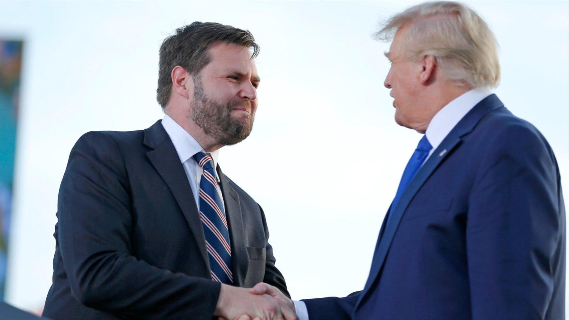 A photo of Donald Trump and J.D. Vance shaking hands