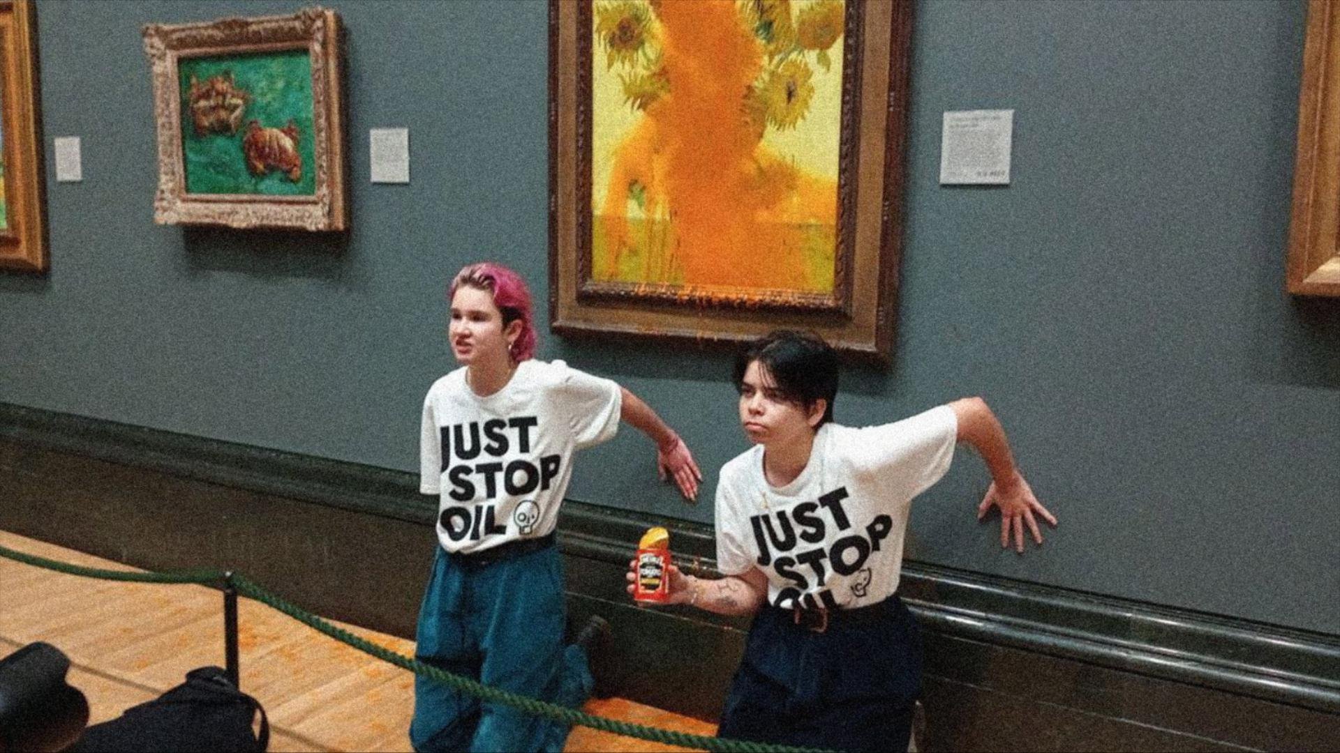 Photo of two protesters from climate activist group
