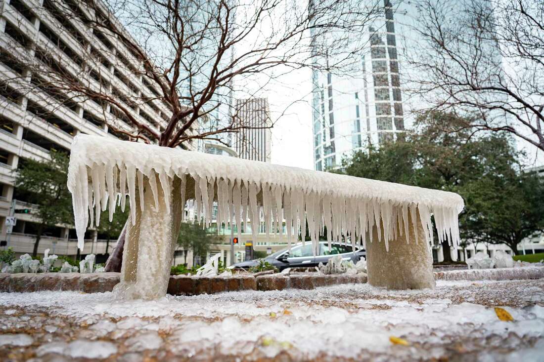 A frozen park bench in downtown Houston.