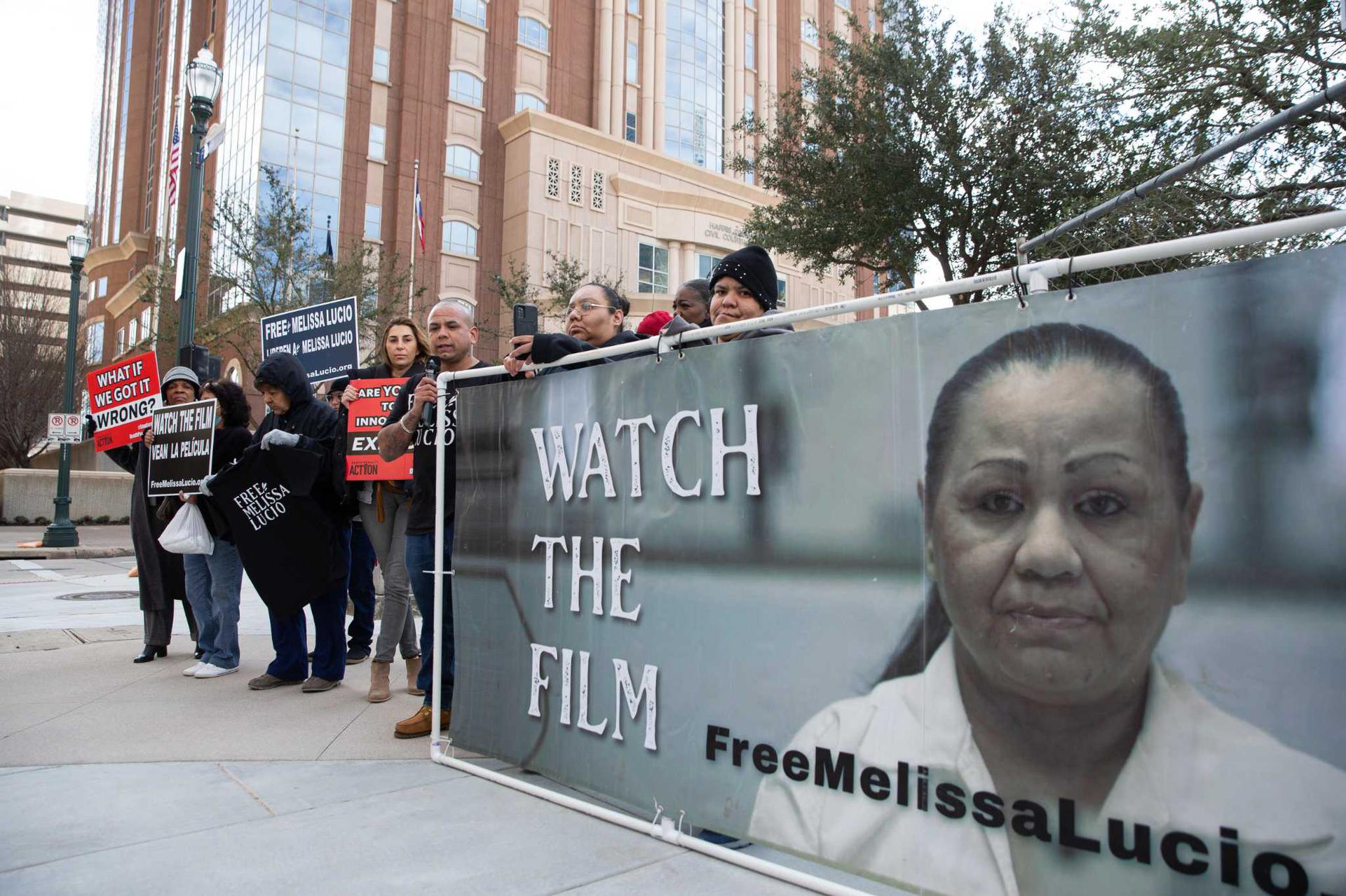 Protestors hold a sign calling for Melissa Lucio to be freed from death row. 