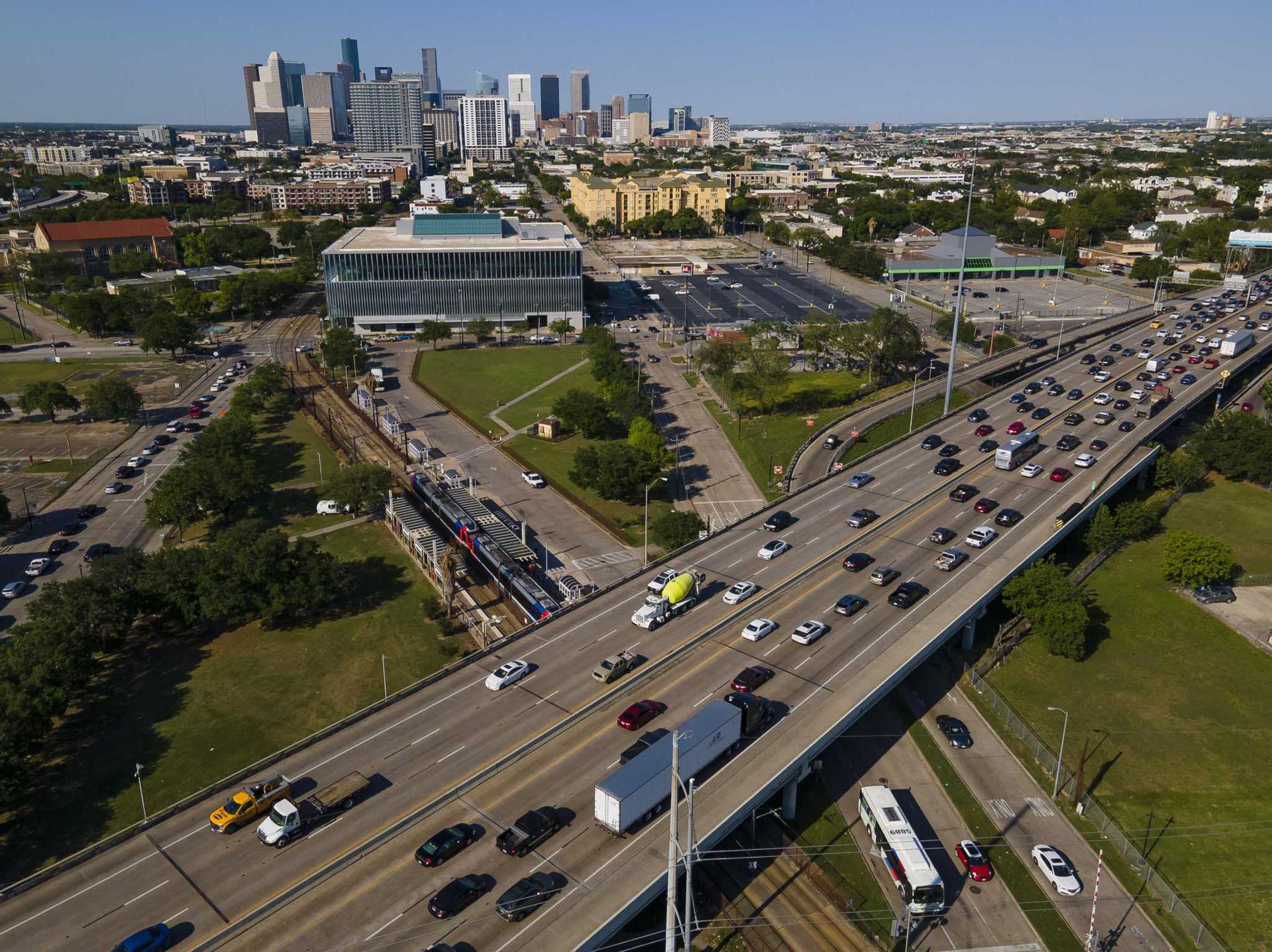 Interstate 69 traffic flows above Metropolitan Transit Center's Wheeler Transit Center on April 21, 2021, in Houston. The planned rebuild of the downtown freeway system connected to the planned Interstate 45 widening would put the new freeway beneath the rail line, with the specifics of how that work and the train will coexist unresolved.