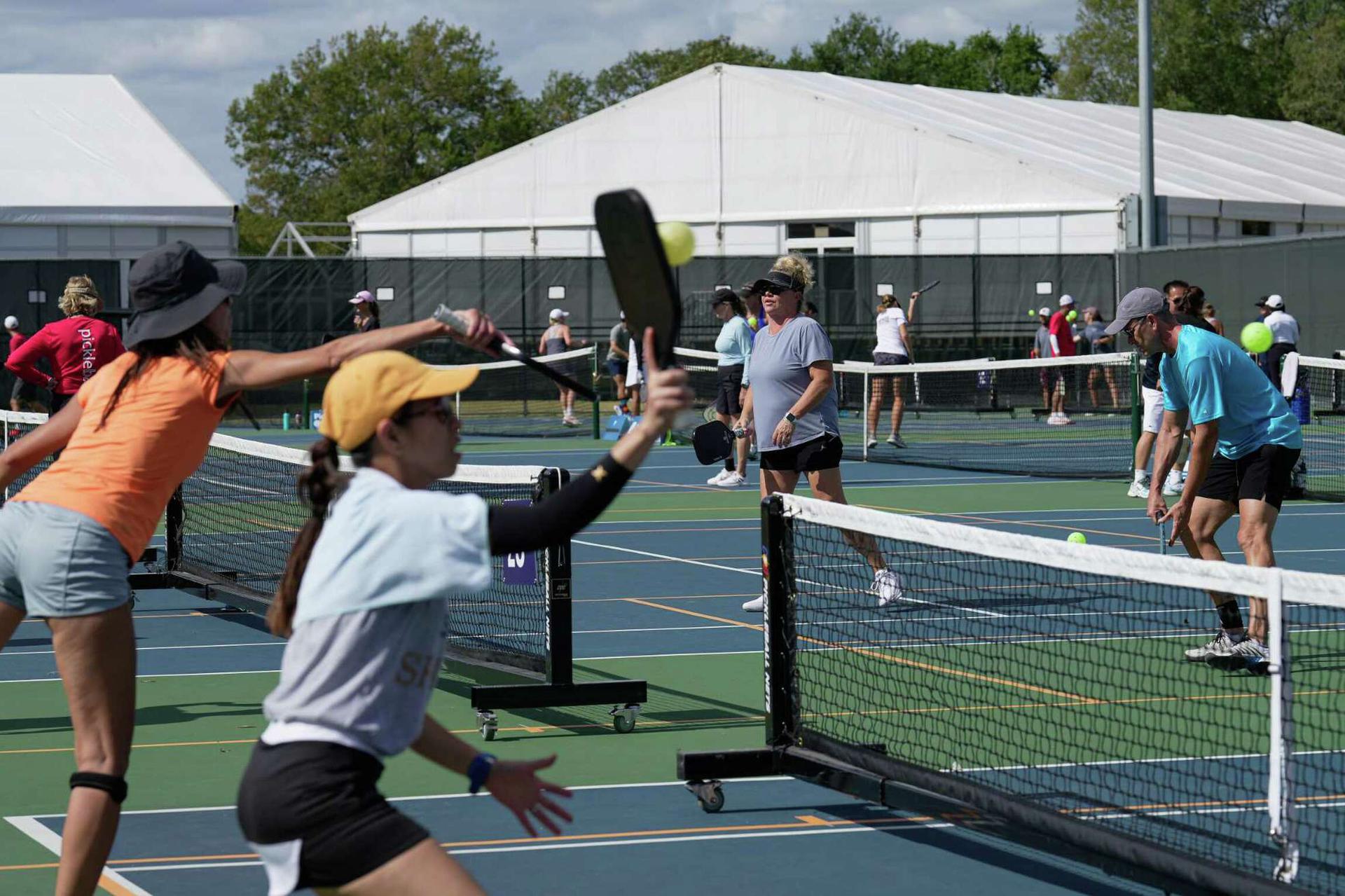 Amateur pickleball players participate the Association of Pickleball Professional Sunmed Houston Open tournament Sunday, Oct. 23, 2022, at Memorial Park Tennis Courts in Houston. It was the first time a national pickleball event of this kind has come to Houston.