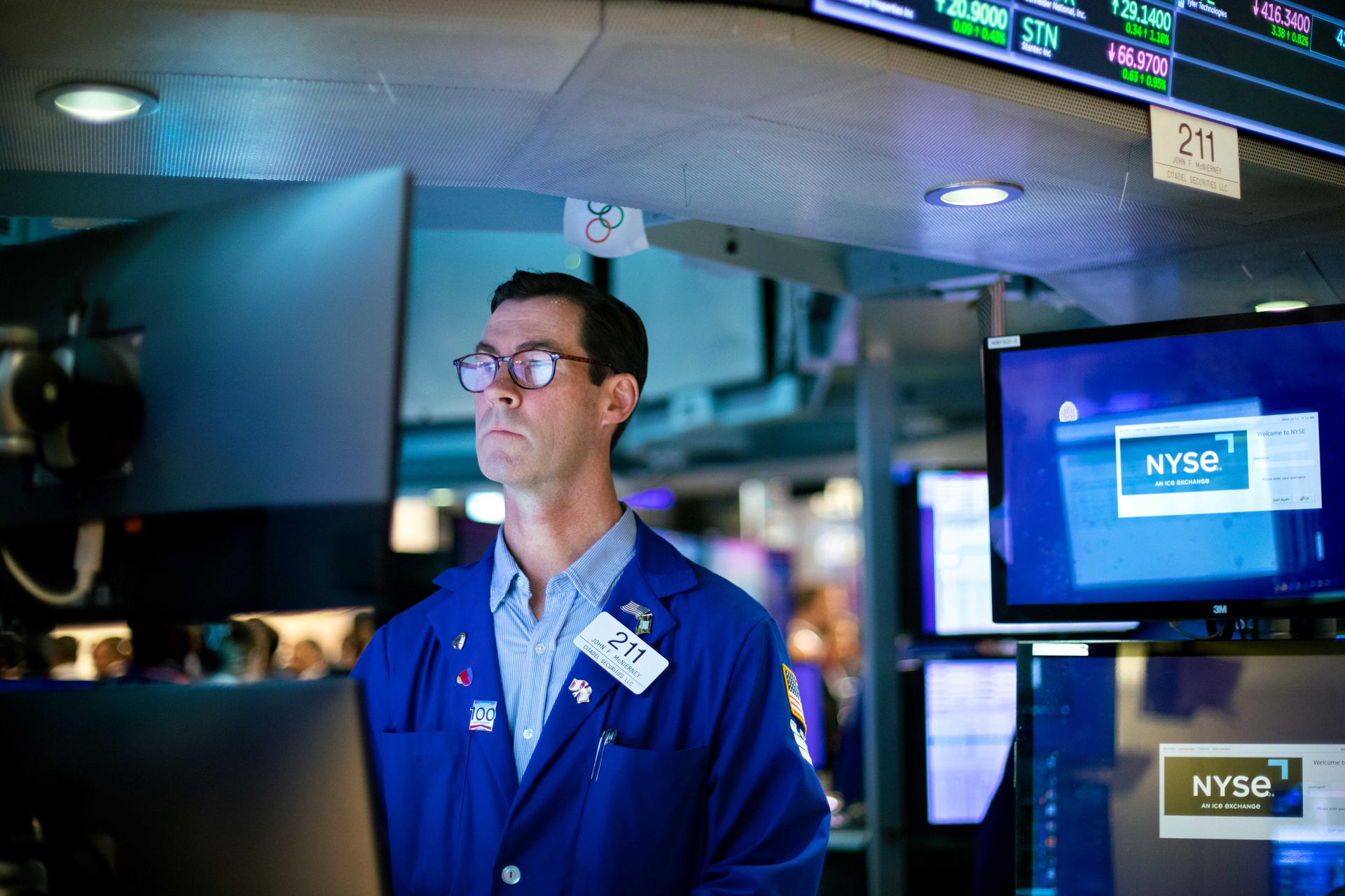 Traders work on the floor of the New York Stock Exchange. 