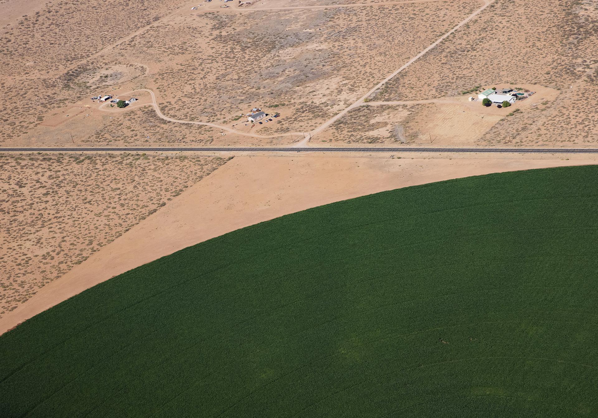 An irrigated crop circle is seen next to a bone dry desert An irrigated crop circle is seen next to a bone dry desert