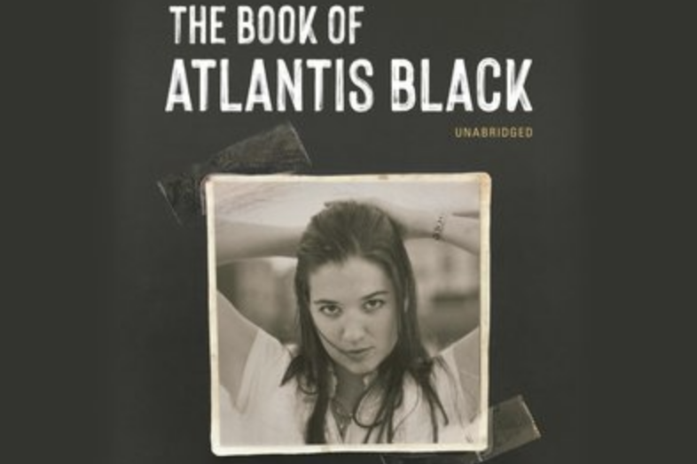 A scrapbook photo of a woman with title of book, ''the book of atlantic black'' A scrapbook photo of a woman with title of book, ''the book of atlantic black''