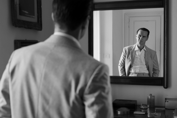 A person looking in a mirror.