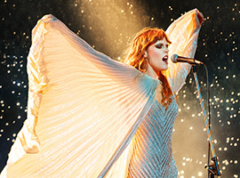 A person singing into a microphone. 