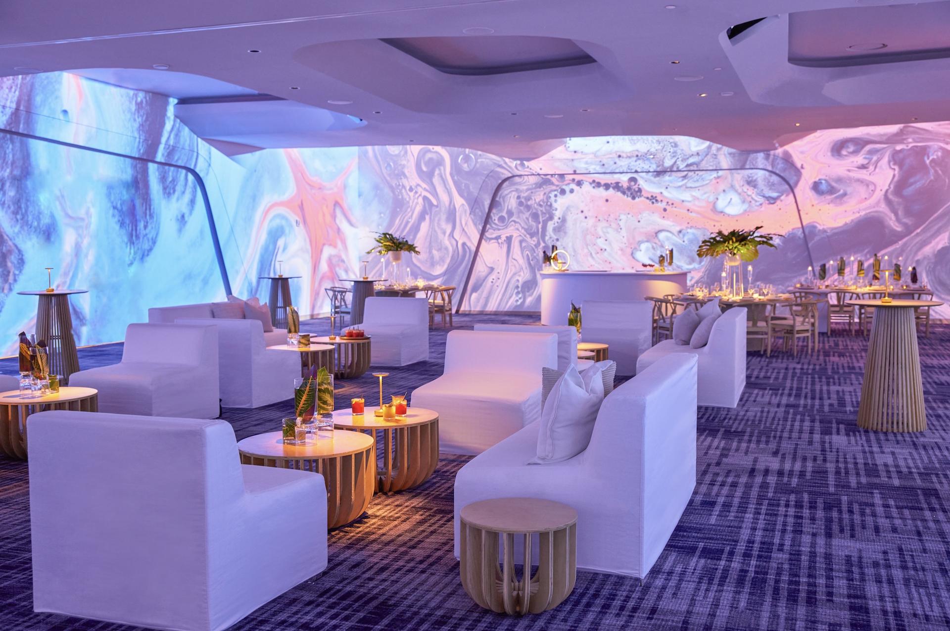 W South Beach's Ballroom with a 360-degree projection screen showing a swirl pattern.