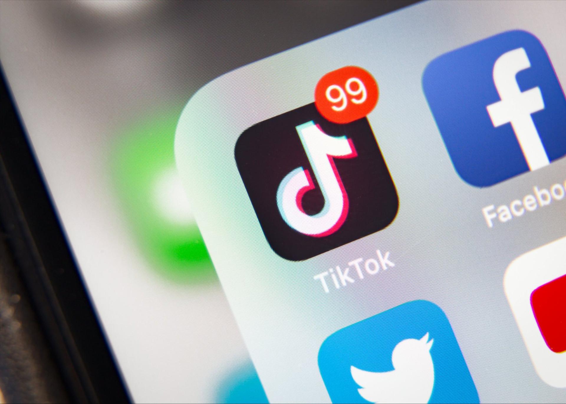 Close up of the Tik Tok app icon displayed on a smartphone