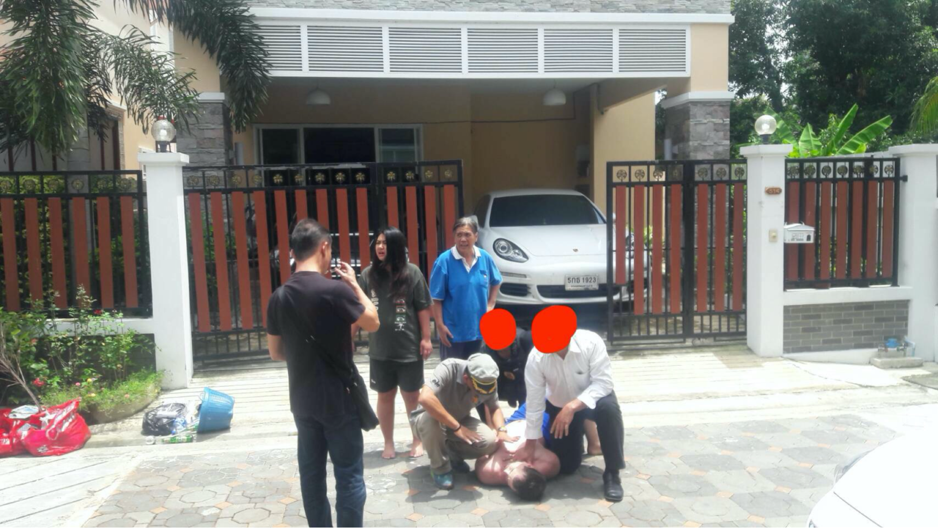 Cazes trying to run, while being grabbed by a figure in a white shirt