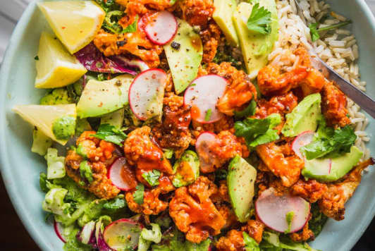 Spicy Buffalo Cauliflower Bowls with Avocado and Green Tahini